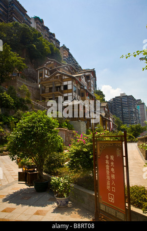 On the steep hills of the peninsular Chongqing city center, imitation traditional chinese houses are newly constructed. Stock Photo