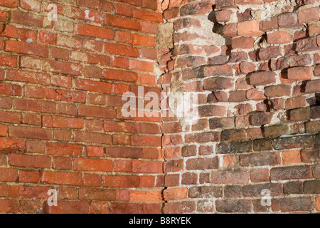 Brick building different colours sidewalls corner. Stock Photo