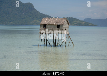 Bajau Laut house built on stilts in lagoon Pulau Maiga Semporna Sulu Sea Malaysia South east Asia Stock Photo