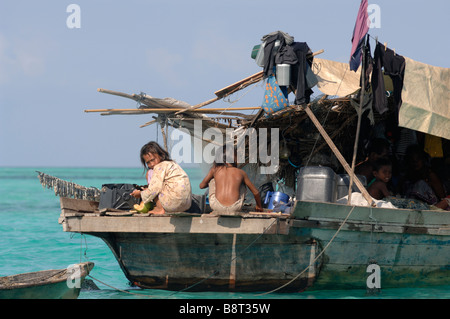 Two young Bajau Laut girls on stern of houseboat Pulau Sibuan Semporna Sulu Sea Malaysia South east Asia Stock Photo