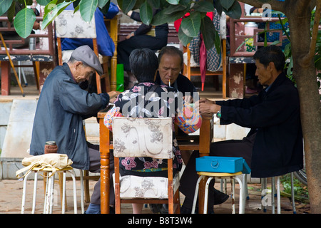 Retired chinese playing Mahjong in a park un Kunming, Yunnan province, China. Stock Photo