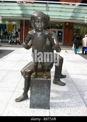 The 'Teulu Family Group' a sculpture by Robert Thomas at Ealing Broadway Shopping Mall, London, England, uk Stock Photo