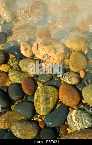 Colorful beach rocks on a Great Lakes shoreline in Northern Michigan, USA Stock Photo