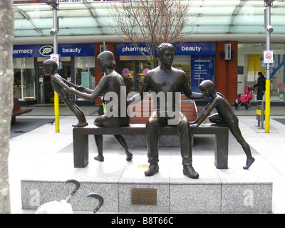 The 'Teulu Family Group' a sculpture by Robert Thomas at Ealing Broadway Shopping Mall, London, England, uk Stock Photo