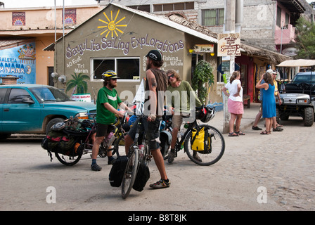 three 3 seriously green bearded boy biker eco tourists on the street in Sayulita, Nayarit, Mexico Stock Photo