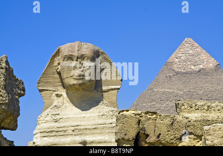 The Great Sphinx of Giza in Egypt. The largest monolithic statue in the world. In the background is Khafre's Pyramid Stock Photo