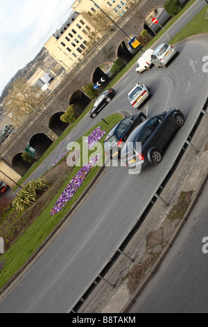 Road traffic flow vehicles approaching a roundabout junction in Bath England Stock Photo