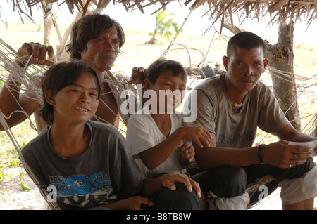 Group of Bajau boys on hammock in shack Pulau Mantabuan Semporna Sabah Malaysia Borneo South east Asia Stock Photo