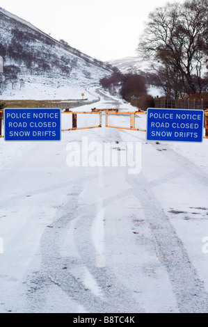 Snow gates on the closed A93 road at Braemar, Cairngorms, looking south up Glen Clunie. Stock Photo