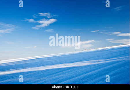 A sunny snowy winter abstract minimalist landscape view or scene on the Downs in Wiltshire England UK Stock Photo