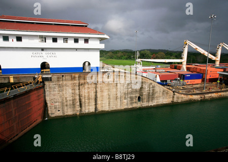 The Panama Canal locks (Spanish: Esclusas del Canal de Panamá) are a lock system that lifts a ship up 85 feet (26 m.) to the main elevation. Galun. Stock Photo