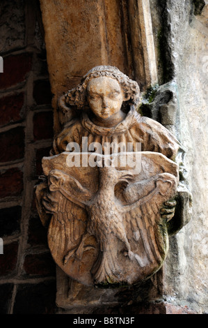 detail close up of stone carved angel church door entrance ornate intricate entrance krakow poland Stock Photo