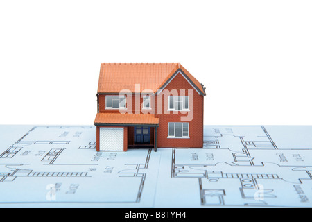 A model house on blueprints with white background Stock Photo