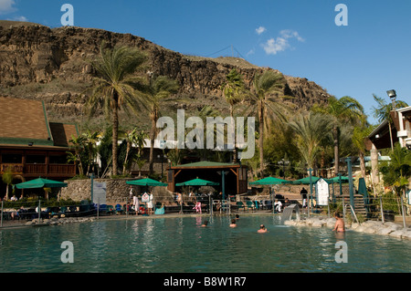 People bath in a pool in Hamat Gader or al-Hamma a hot springs site in the Yarmouk River valley in Golan Heights Israel Stock Photo