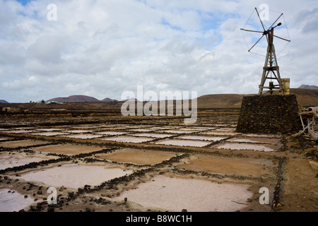 A windmill in an abandoned saltmine, Salinas de Janubio, Lanzarote island, Spain. Stock Photo