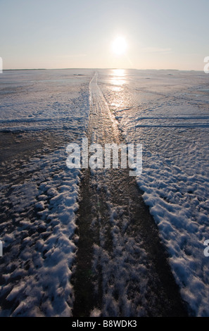 Frozen snowmobile track on sea ice , Finland Stock Photo