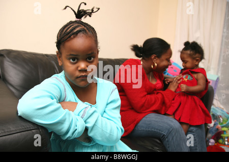 6 year old girl jealous of her younger sister and feeling left out Stock Photo