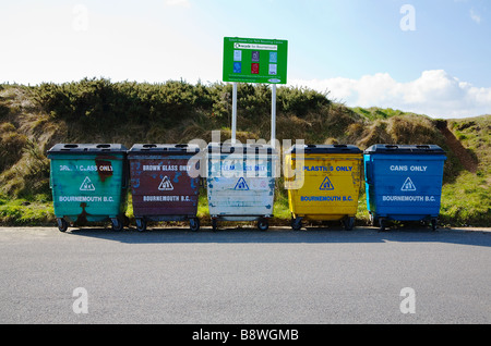 Bournemouth Council, Solent Meads Recycling Centre. Bournemouth, Dorset. UK. Row of five bins for glass, plastic and cans. Stock Photo