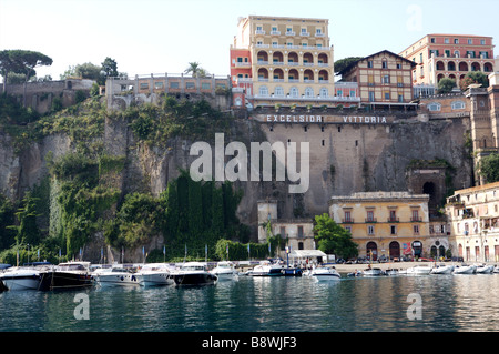 The back of the exclusive hotel 'Excelsior Vittoria' in Sorrento Italy with the boats in the lower harbor Stock Photo