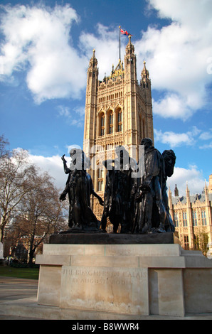 The Burghers of Paris statue, Victoria Tower and the Palace of Westminster in London England.  Mar 09 Stock Photo