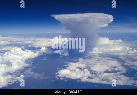 Cumulonimbus Incus Anvilheads flat topped Cumulus Nimbus cloud from airplane cockpit window HOMER SYKES Stock Photo