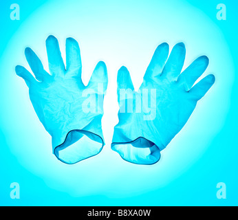 surgical gloves on a cold blue sterile background Stock Photo