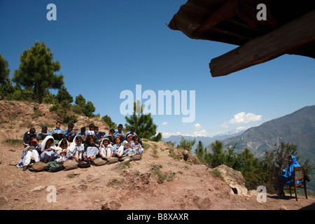 lesson in elementary school in the mountains surrounding Muzzafarabad in Azad Jammu and Kashmir in Pakistan Stock Photo