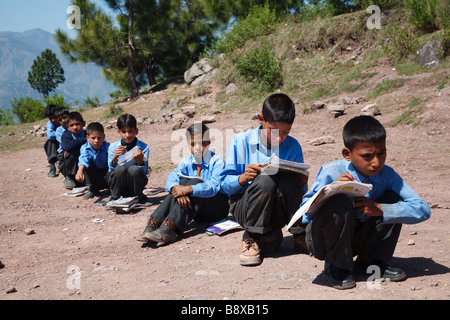 lesson in elementary school in the mountains surrounding Muzzafarabad in Azad Jammu and Kashmir in Pakistan Stock Photo