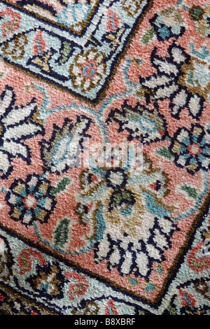 Close up of the pattern on a silk rug handmade in Kashmir Stock Photo