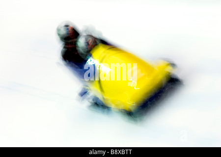 Two man bobsled in action Stock Photo