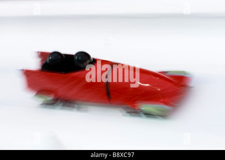 Two man bobsled in action Stock Photo