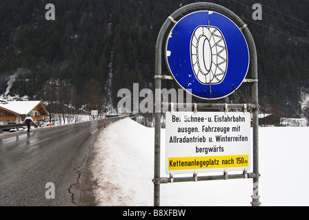 traffic sign on winter road Mayrhofen Austria Stock Photo