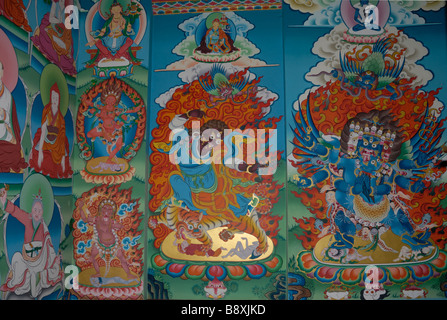 Mural paintings depicting demons in the prayer hall of a newly renovated and extended nunnery near Trashigang. Stock Photo