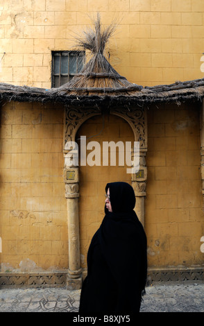 muslim arab woman walking walk through the streets of the Old Medina market Place des Nations Unies Casablanca Morocco Stock Photo