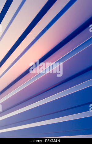 Waved blue metal sheet pattern on sunset. Stock Photo