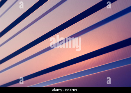 Waved blue metal sheet pattern on sunset. Stock Photo