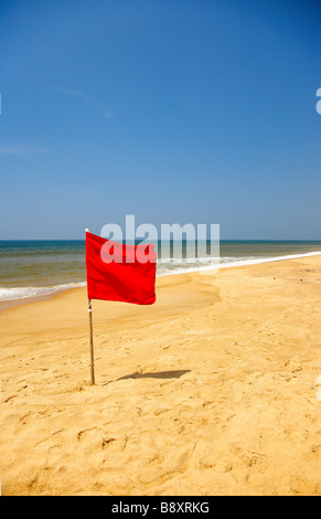 Red Danger Flag at Calndolim Beach Goa India Stock Photo