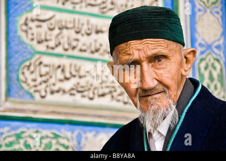 Old muslim man looking straight to the camera. Bukhara, Uzbekistan, Asia Stock Photo