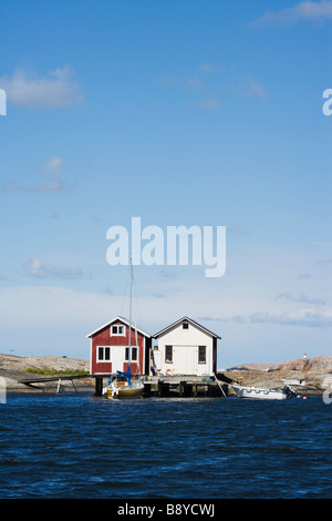 Fishing huts by the ocean Smogen Bohuslan Sweden. Stock Photo