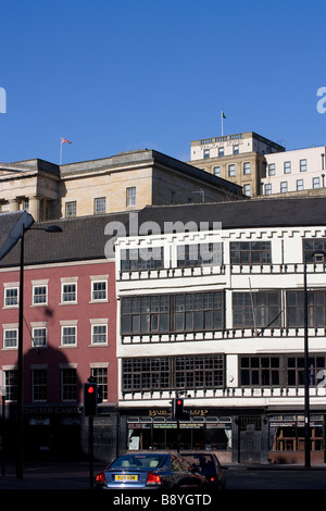 Flags flying above and beside The Vermont Hotel Newcastle upon Tyne overlooking quayside Stock Photo