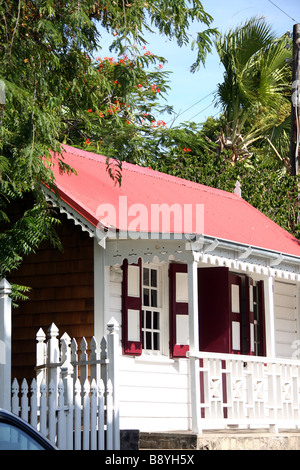 A house painted in typical Caribbean bright colours in Orange city on the island Saint Eustace in the Netherlands Antilles Stock Photo