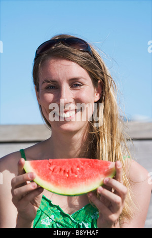 A woman having a water melon Sweden. Stock Photo