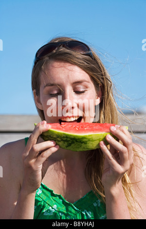 A woman having a water melon Sweden. Stock Photo