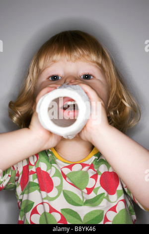 A girl playing with a roll of paper Sweden. Stock Photo