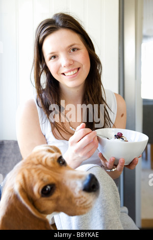 A young woman having breakfast Sweden. Stock Photo