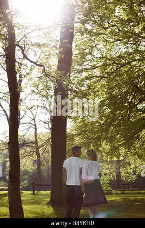 Couple walking in a forest Copenhagen Denmark. Stock Photo