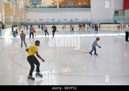 skaters on ice rink in shopping mall, dubai, uae Stock Photo