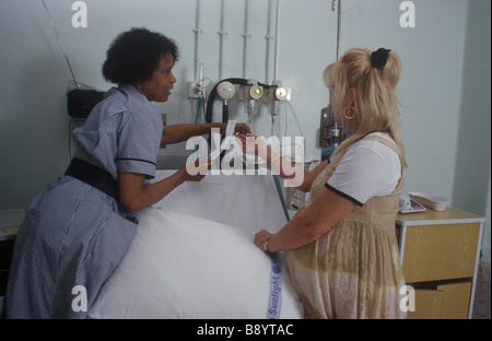 nurse showing pregnant woman around a delivery suite Stock Photo