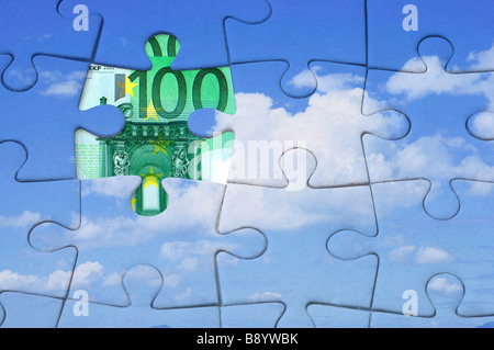 Paper money under a jigsaw puzzle of clear sky pattern Stock Photo