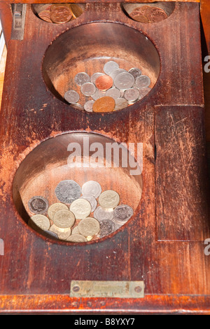 A close up of an old fashioned shop store cash till with money in it Stock Photo